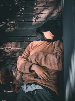 A girl resting with her dog.